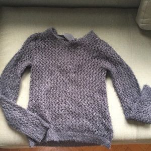 Delia’s dark gray sweater.